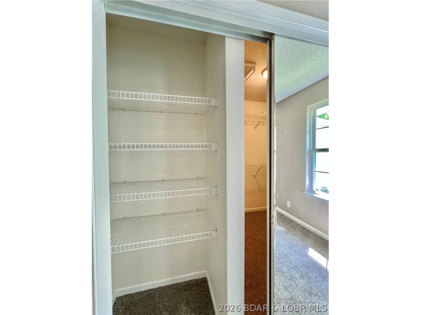 This lovely home is located in a sought-after 55+ community and - photo 26