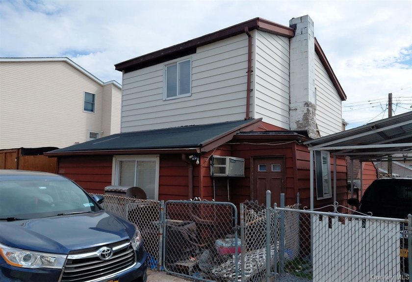 This two-story home features two bedrooms, a full bath, an - photo 2