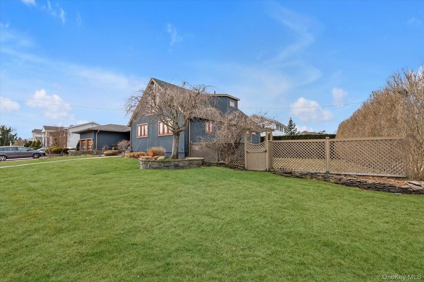 Welcome to this stunning expanded ranch located in the highly - photo 3