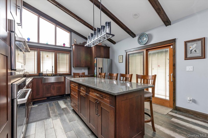 Welcome to this stunning expanded ranch located in the highly - photo 8