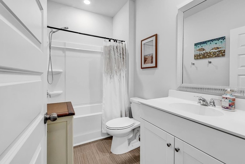 Welcome home to Coastal Charm at the Beach, a beautifully - photo 17
