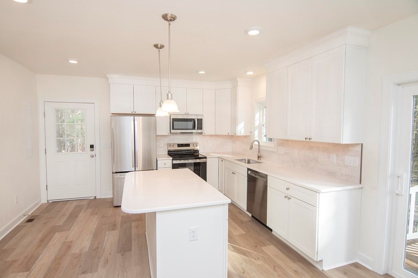 Discover modern coastal living in this stunning 3-bedroom - photo 2