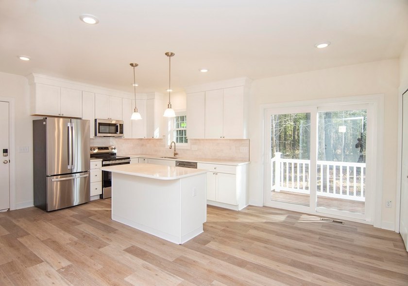 Discover modern coastal living in this stunning 3-bedroom - photo 5