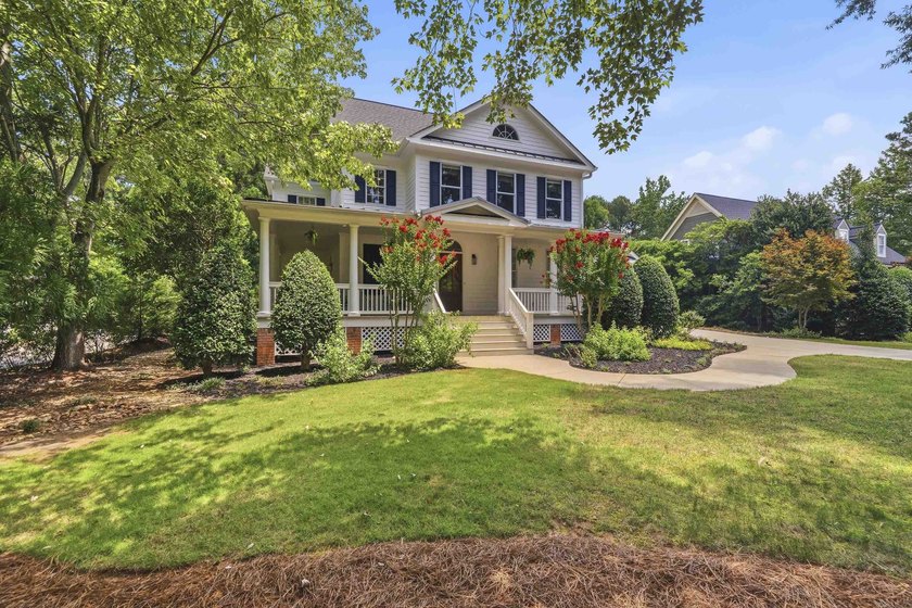Nestled within the coveted Parkside enclave of Cuscowilla on - photo 2