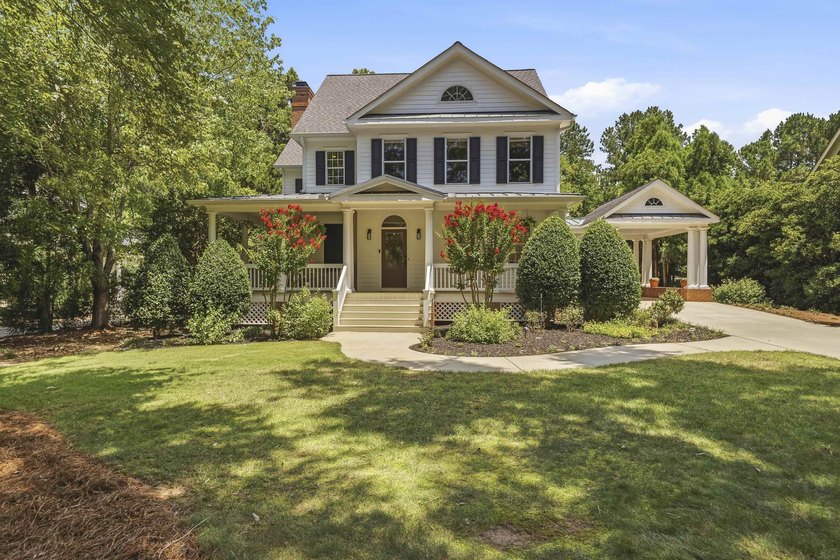 Nestled within the coveted Parkside enclave of Cuscowilla on - photo 4
