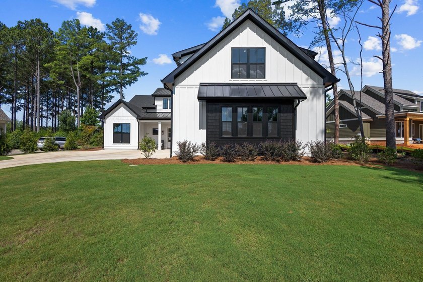 Nestled in the heart of Cuscowilla on Lake Oconee, this - photo 2