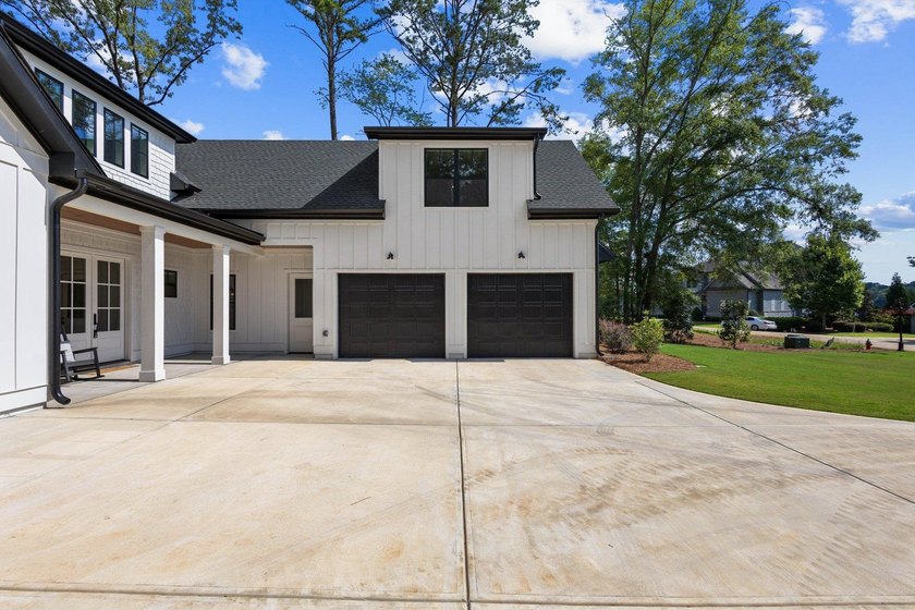 Nestled in the heart of Cuscowilla on Lake Oconee, this - photo 4