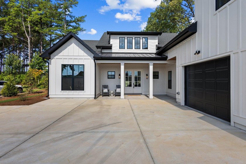 Nestled in the heart of Cuscowilla on Lake Oconee, this - photo 5