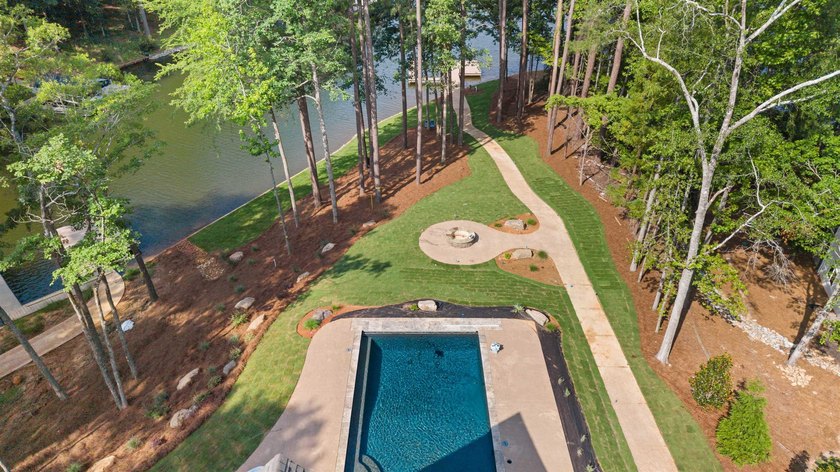 The Hearth is a waterfront home designed around the moments that - photo 2