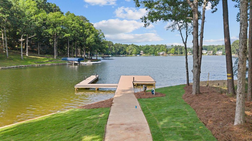 The Hearth is a waterfront home designed around the moments that - photo 4