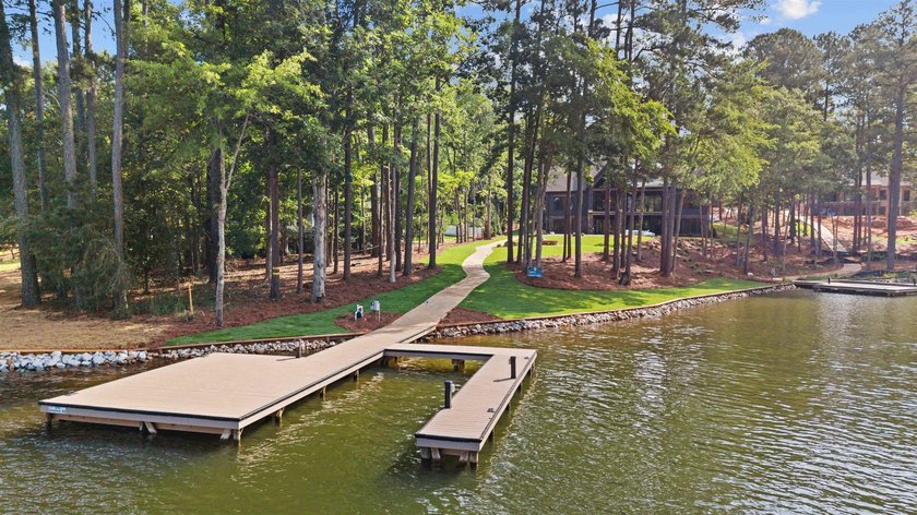 The Hearth is a waterfront home designed around the moments that - photo 5