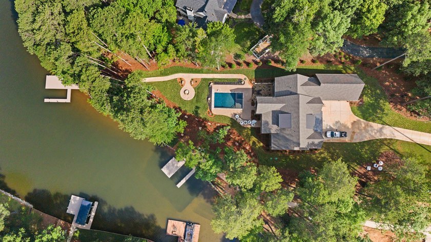 The Hearth is a waterfront home designed around the moments that - photo 9