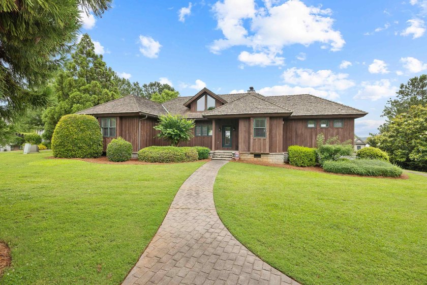 Nestled in the heart of Cuscowilla and close to everything, this - photo 3