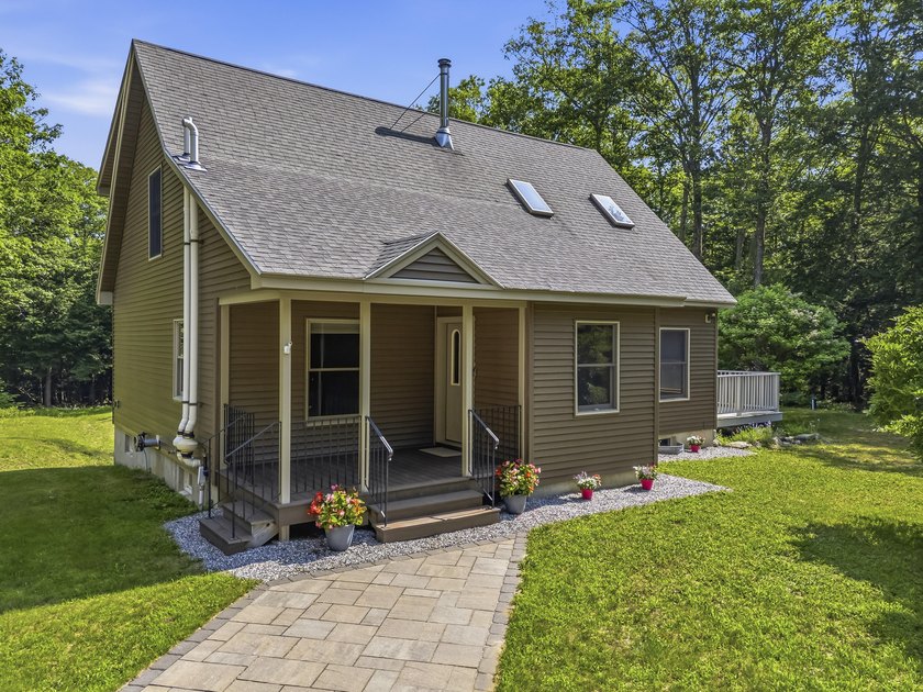 Nestled on 8 private acres, this charming 1862 sq. ft - photo 2