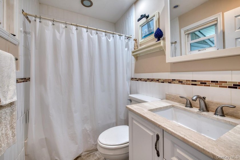 This sun-drenched 2-bedroom, 1-bath waterfront co-op is one - photo 6