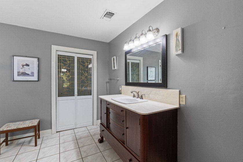 Enjoy morning coffee in your sunroom overlooking the private - photo 12