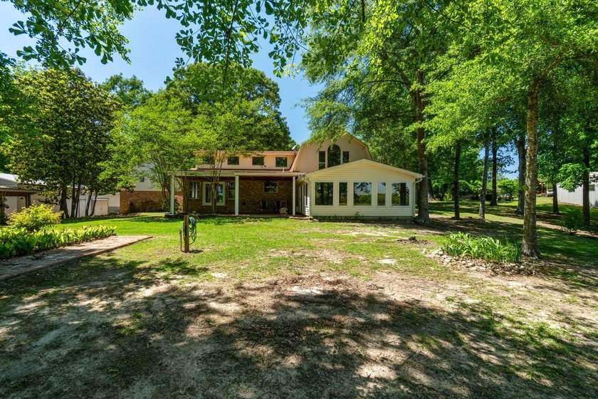 Enjoy morning coffee in your sunroom overlooking the private - photo 30