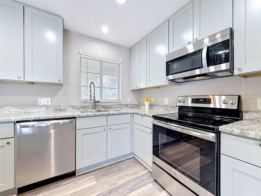 Welcome to this beautifully updated 4-bedroom, 2-bath home - photo 11