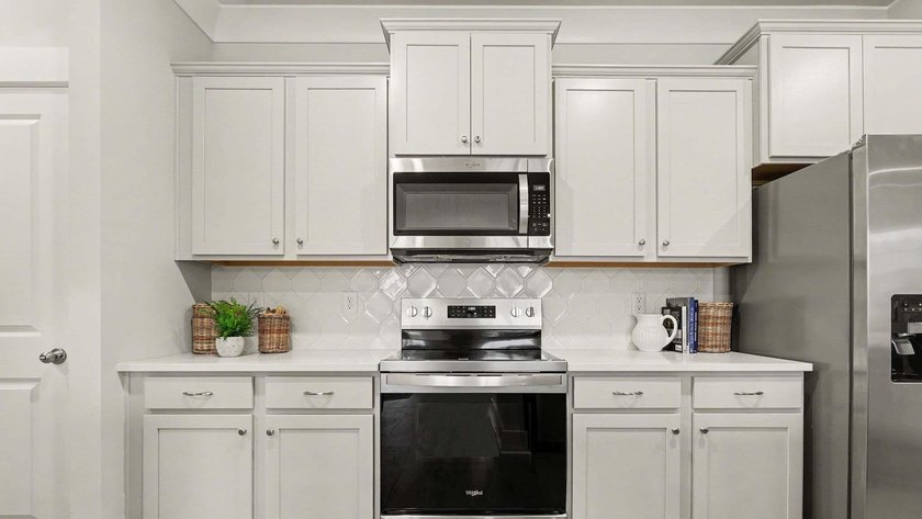 *4 bedrooms, 2.5 baths *Welcoming front porch and screened in - photo 11