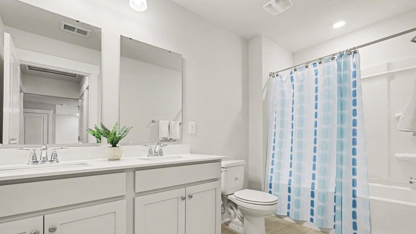 *4 bedrooms, 2.5 baths *Welcoming front porch and screened in - photo 32