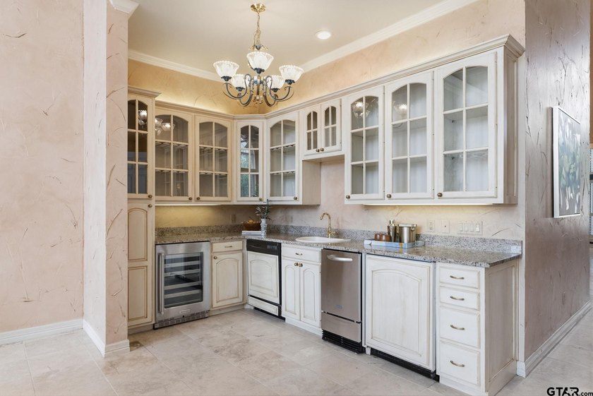 This extraordinary estate is located in the gated community of - photo 11