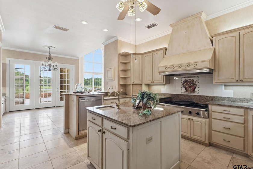 This extraordinary estate is located in the gated community of - photo 14