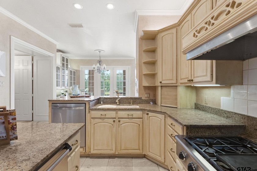 This extraordinary estate is located in the gated community of - photo 16