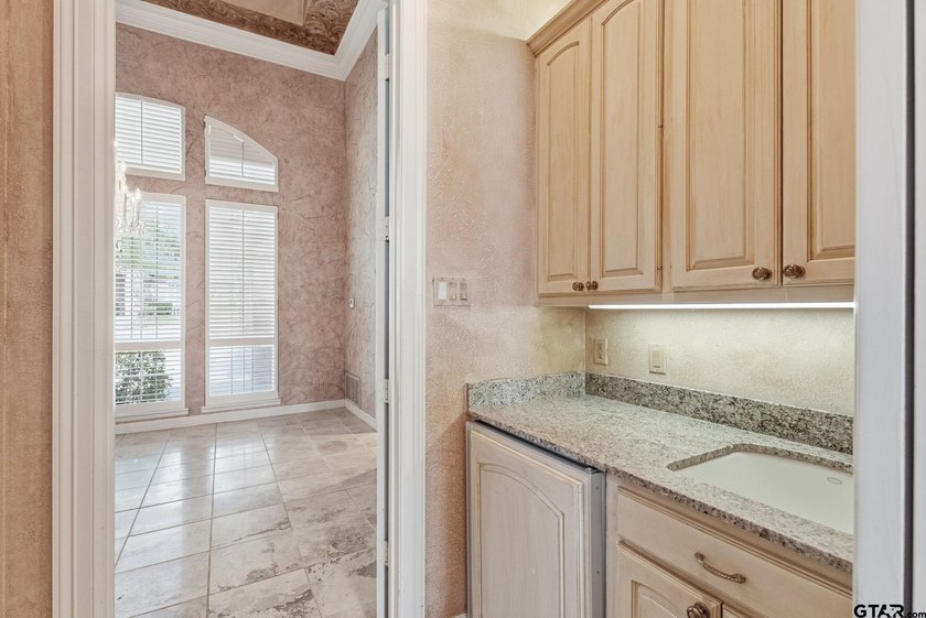 This extraordinary estate is located in the gated community of - photo 19