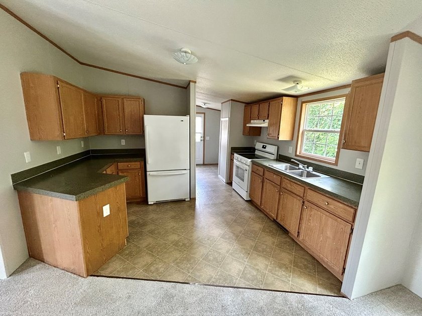 This 3-bedroom, 2-bathroom home is located on the outskirts of - photo 3