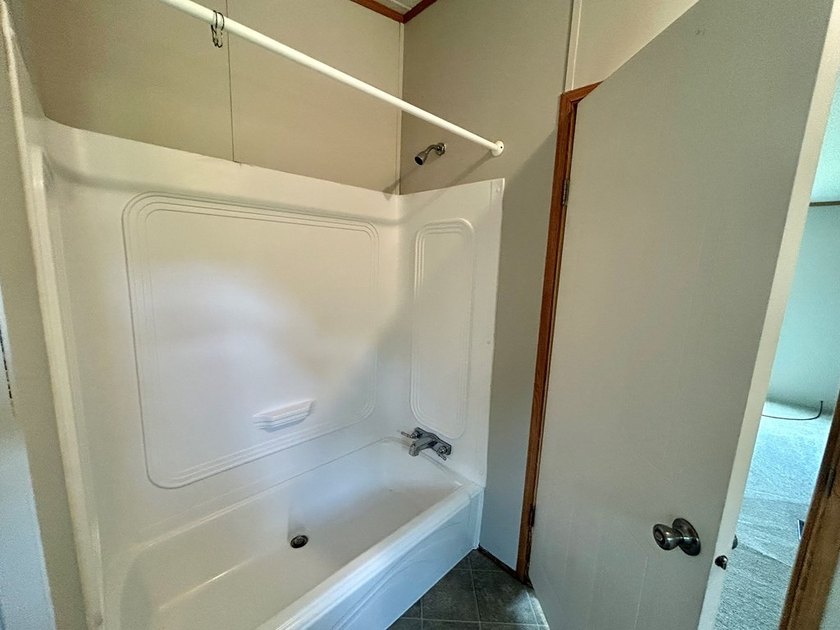 This 3-bedroom, 2-bathroom home is located on the outskirts of - photo 4