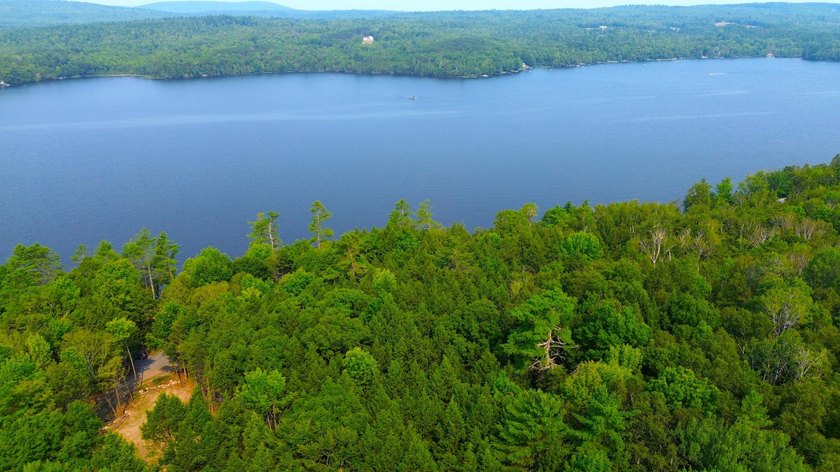 Located in a quiet lake community, this serene 1.02 acre parcel - photo 3