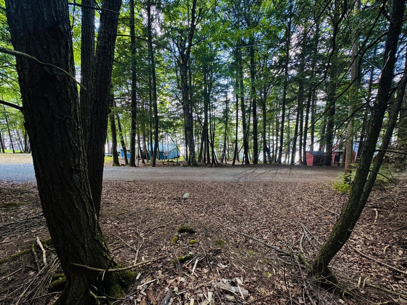 Located in a quiet lake community, this serene 1.02 acre parcel - photo 4