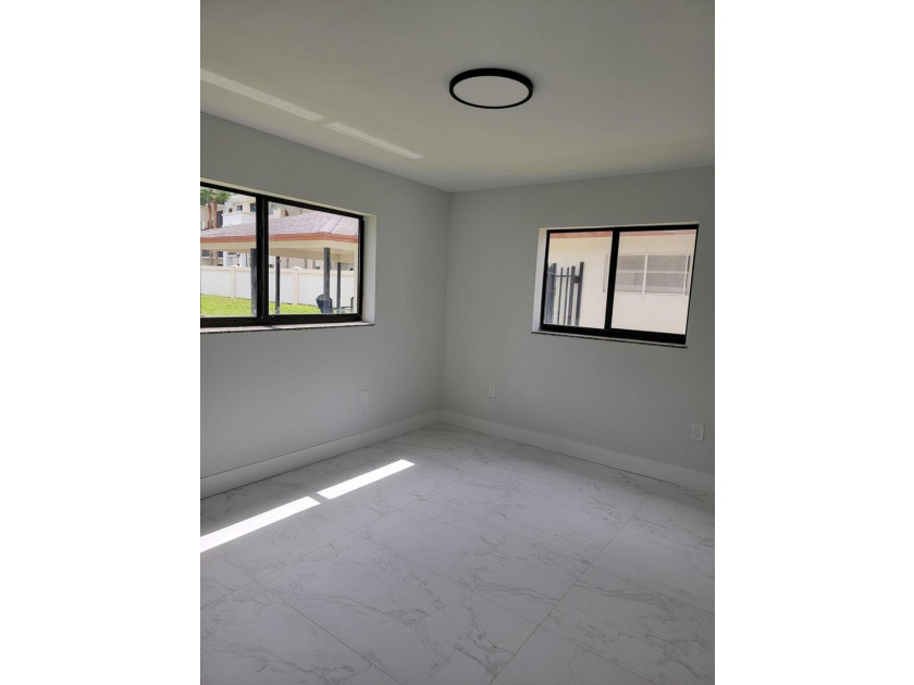 I am pleased to present this fully renovated, with new - photo 11
