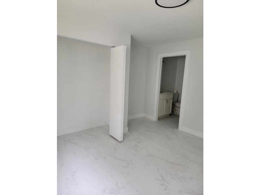 I am pleased to present this fully renovated, with new - photo 15
