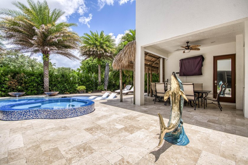 A private backyard paradise with a custom Van Kirk pool, tiki - photo 50