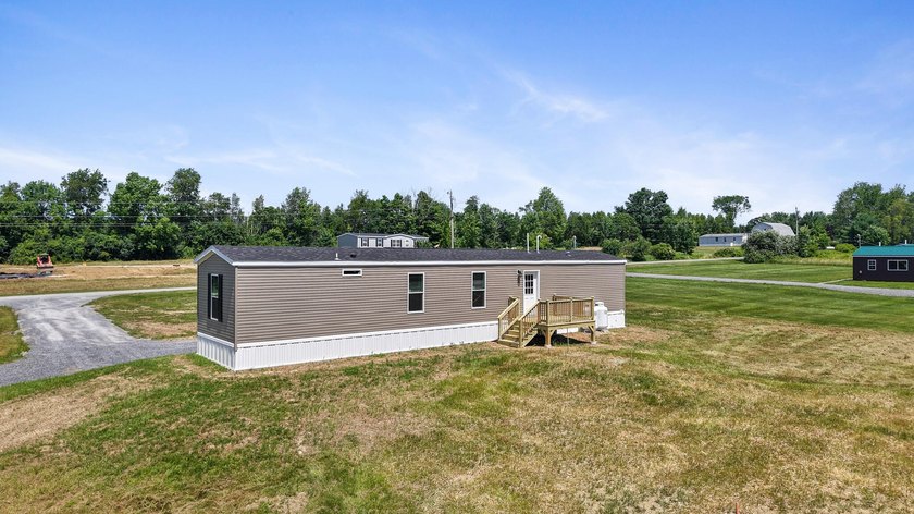 Welcome to easy, worry-free living in this brand-new 2-bedroom - photo 4