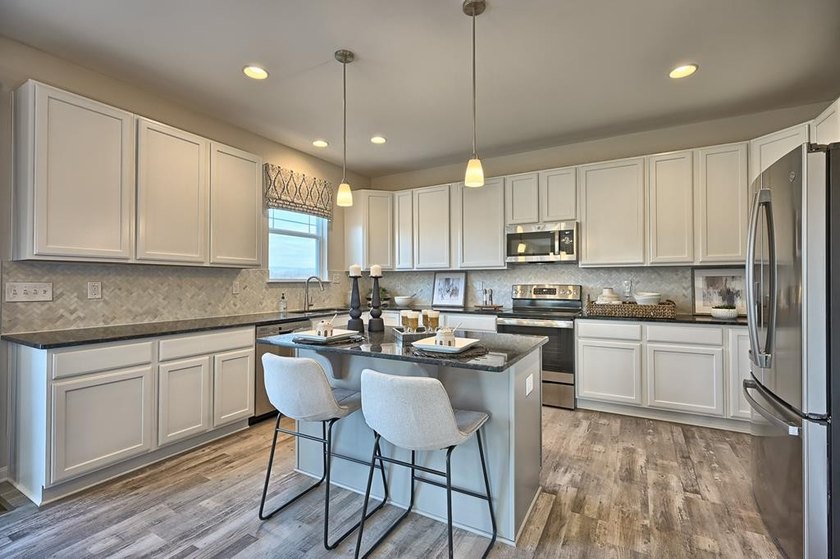 The Hamilton offered by Gemcraft Homes at Captains Cove. As you - photo 7