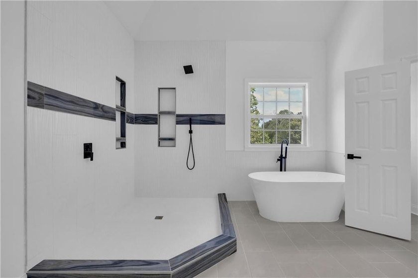 This stunning newly built residence in Douglasville offers the - photo 14