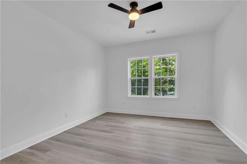 This stunning newly built residence in Douglasville offers the - photo 16