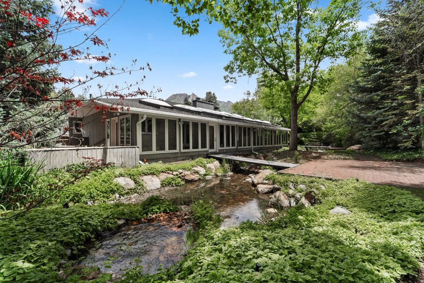 Tucked away behind a private tree-lined drive in one of - photo 3