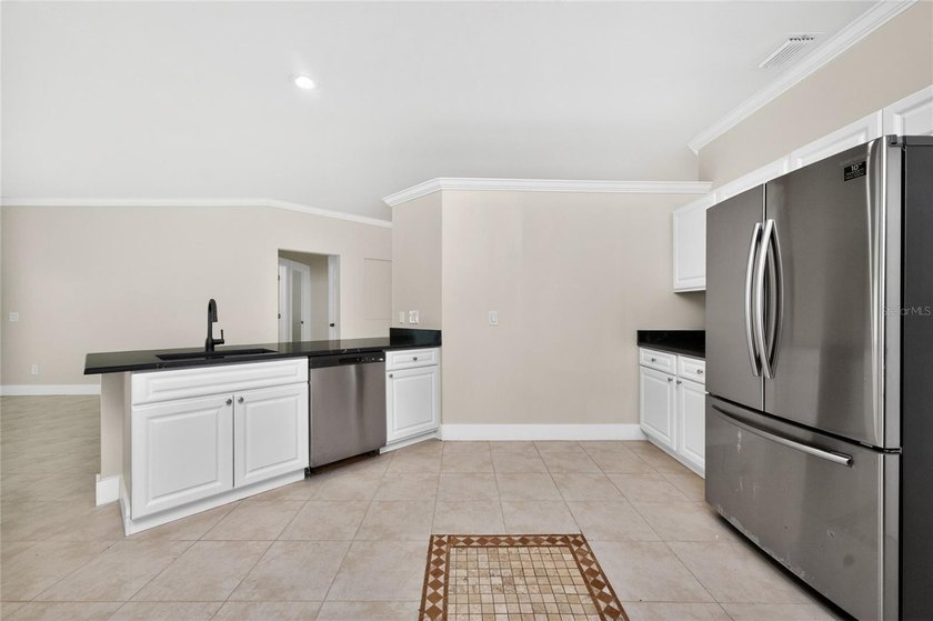 This 2,019-square-foot Cape Coral home features 3 Bedrooms, 2 - photo 22