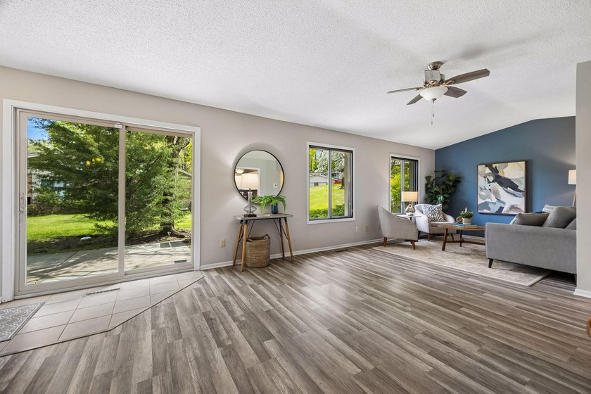 Welcome to this inviting end-unit townhome in the desirable - photo 2