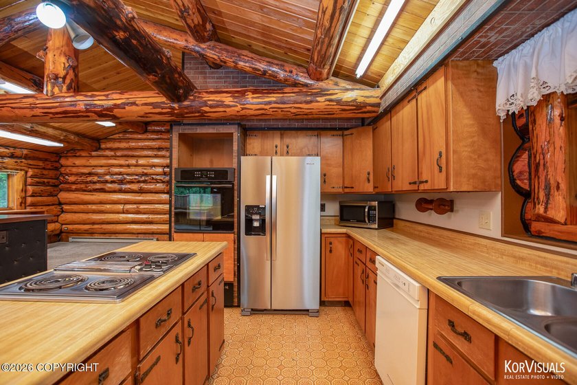 Experience the warmth and character of log home living in this - photo 11