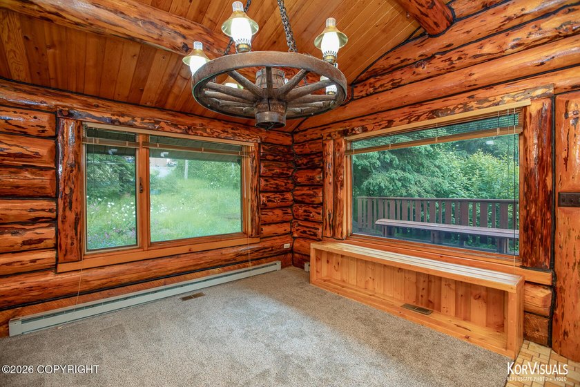 Experience the warmth and character of log home living in this - photo 13