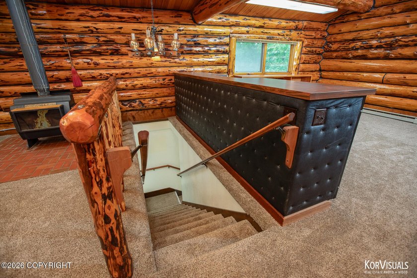Experience the warmth and character of log home living in this - photo 17