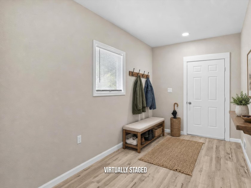 This beautifully renovated 5-bedroom, 2-bath home has been - photo 3