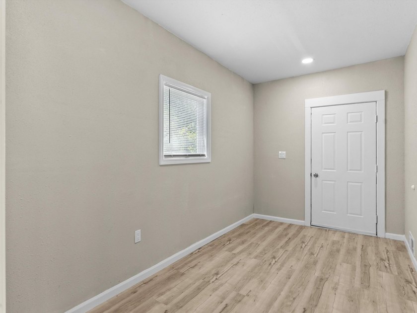 This beautifully renovated 5-bedroom, 2-bath home has been - photo 4