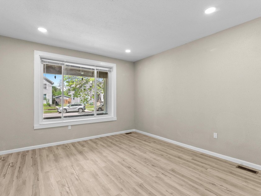 This beautifully renovated 5-bedroom, 2-bath home has been - photo 7