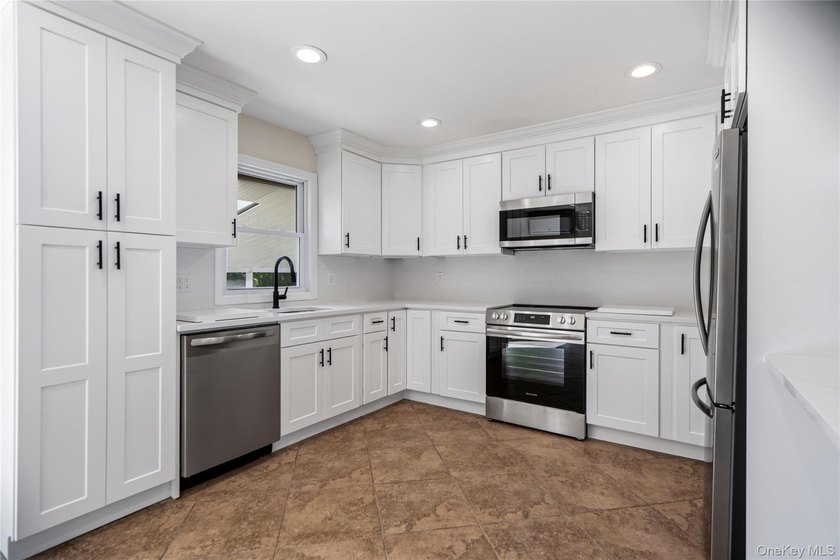 Welcome to this beautifully renovated 4-bedroom, 2-bath Cape - photo 11