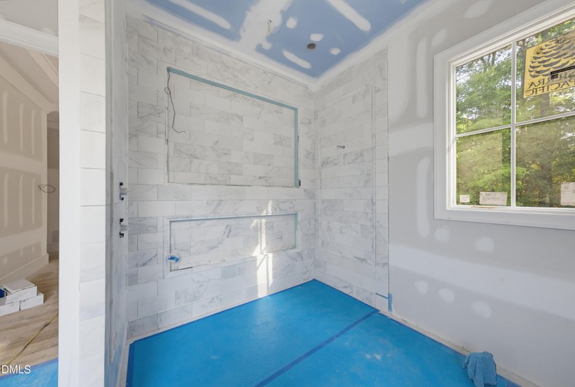Crafted by Wagoner Homes, this extraordinary 5,032-square-foot - photo 17